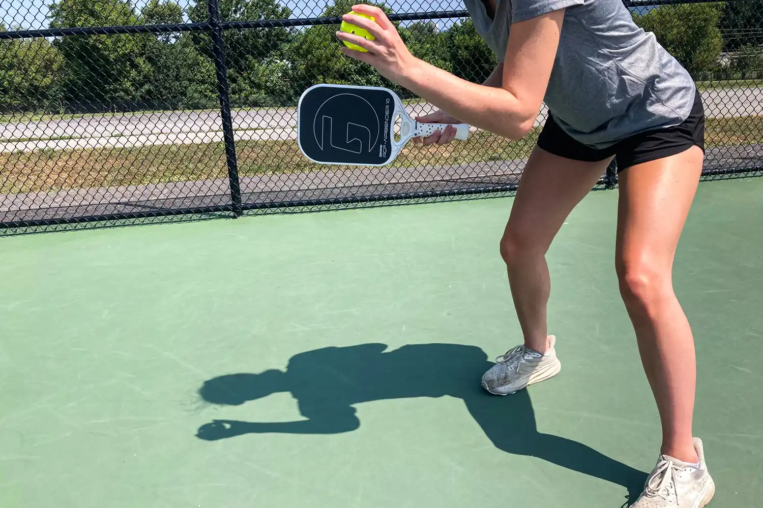 A person uses the GAMMA Airbender 10 Pickleball Paddle to play pickleball