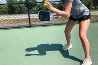 A person uses the GAMMA Airbender 10 Pickleball Paddle to play pickleball
