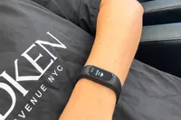 A person wears the Garmin vívosmart 5 Fitness Tracker