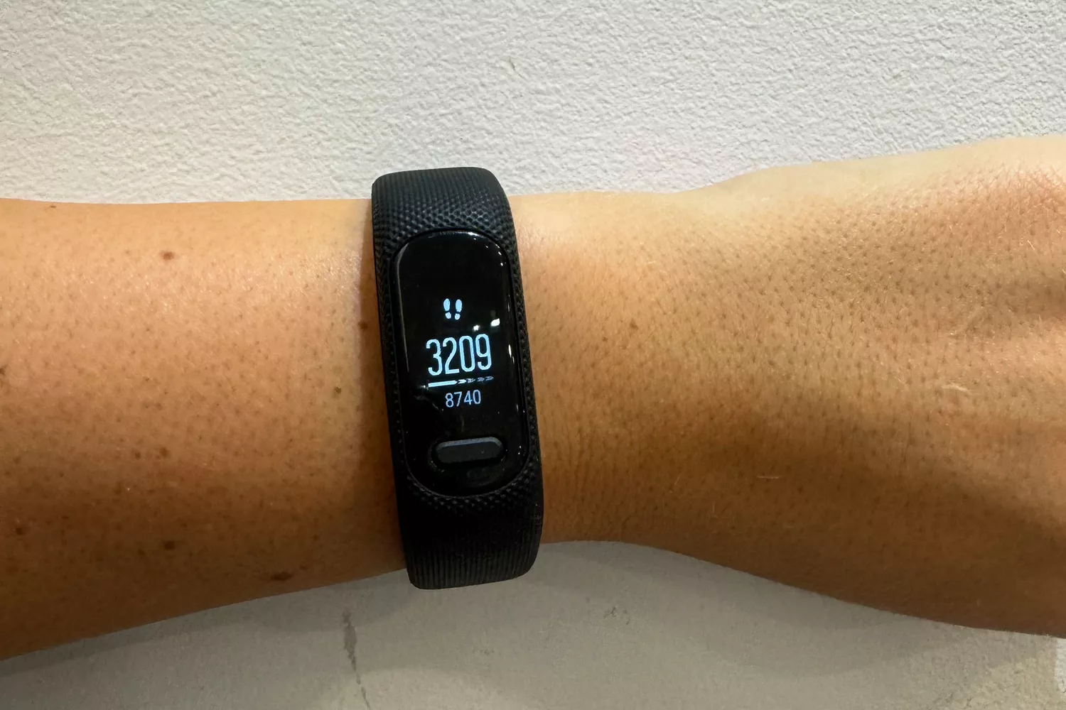 A person wears the Garmin vívosmart 5 Fitness Tracker