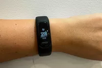 A person wears the Garmin vívosmart 5 Fitness Tracker