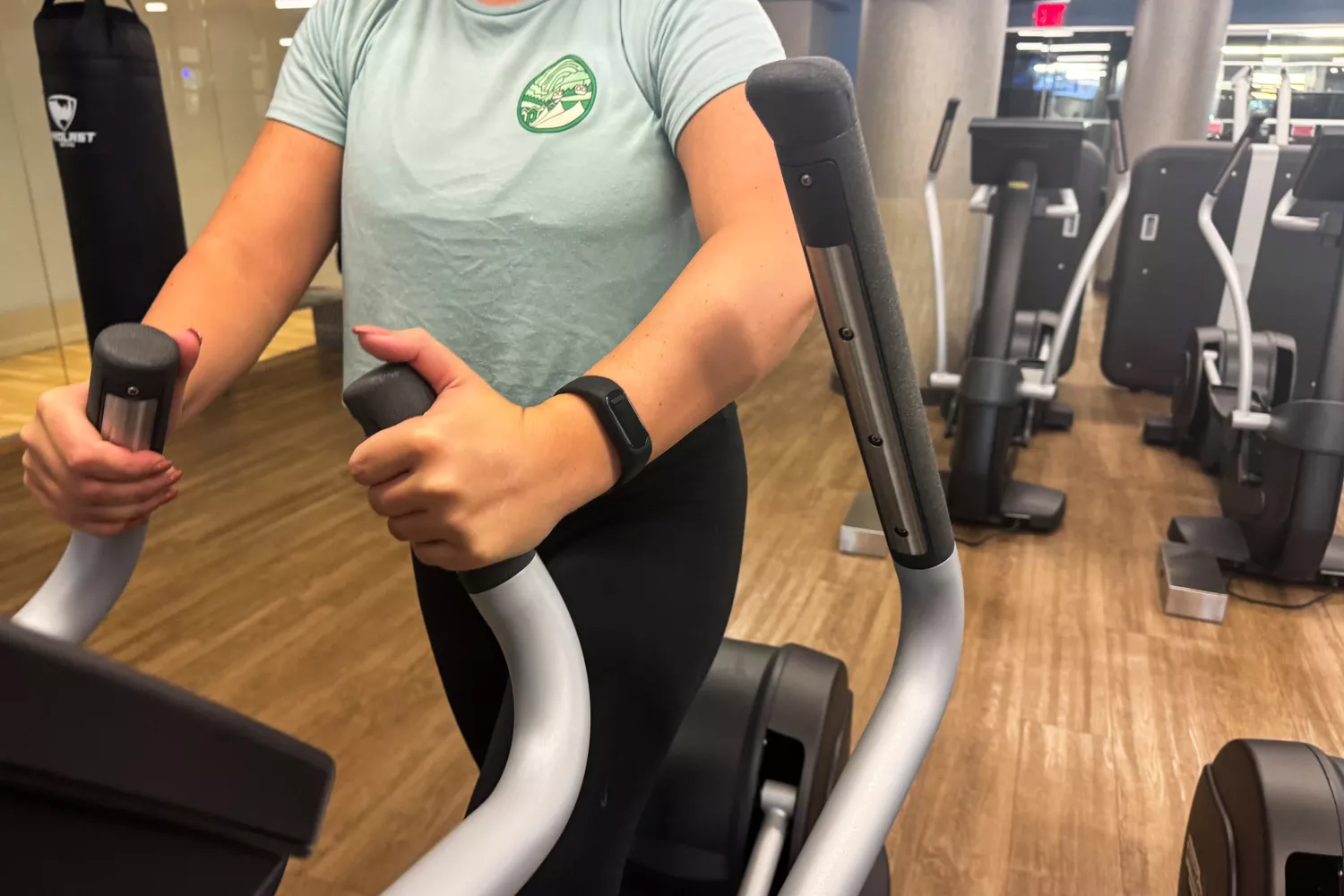 A person exercises while wearing the Garmin vívosmart 5 Fitness Tracker