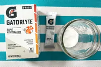 A Gatorlyte box singleserving powder packet and glass jar with powder shown