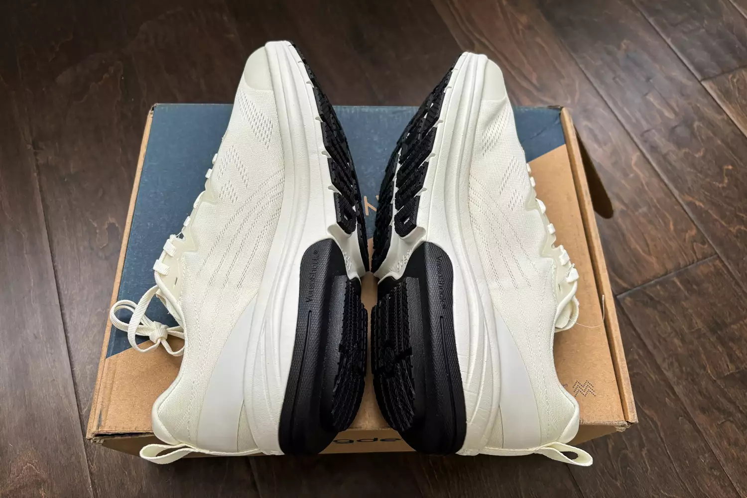 A side view of the GDEFY Men's Lauff Athletic Shoes on a shoebox