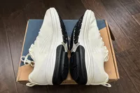 A side view of the GDEFY Men's Lauff Athletic Shoes on a shoebox