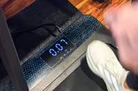 A person walks on the GoPlus 2 in 1 Folding Treadmill