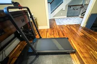 The GoPlus 2 in 1 Folding Treadmill on a wooden floor