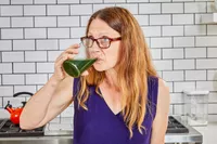 Person drinking glass of BioSteel Powdered Greens Antioxidant Superfood