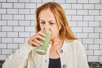 Person drinking Sakara Organic Protein + Greens Super Powder