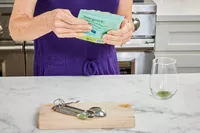 Person holding packet of True Grace Superfood Powder Broccoli Microgreens