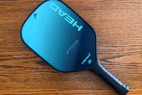 The HEAD Attitude Core Pickleball Paddle on a wooden table
