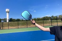 A person holds the HEAD Attitude Core Pickleball Paddle
