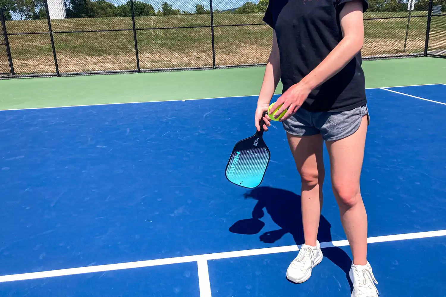 A person holds the HEAD Attitude Core Pickleball Paddle