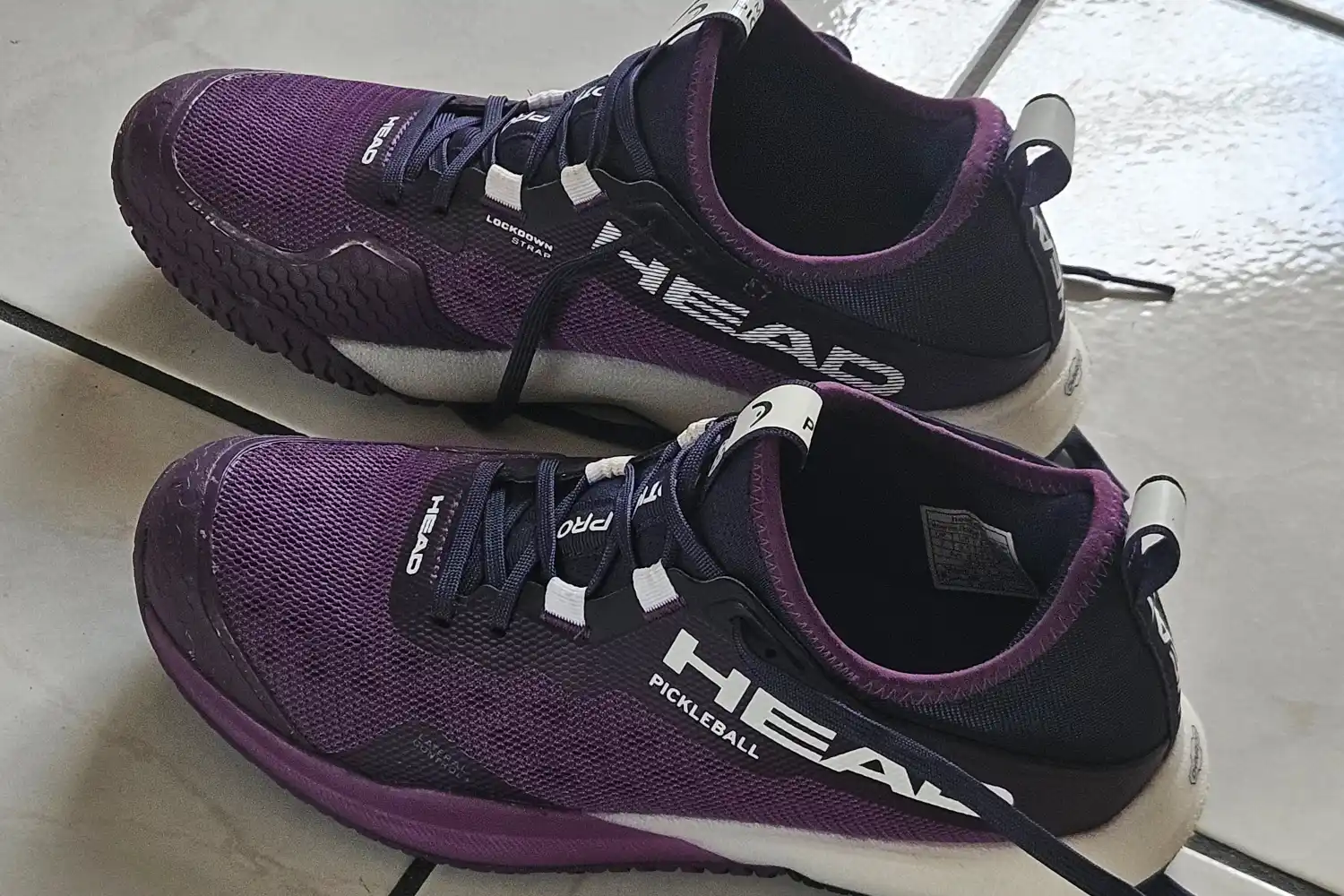 A pair of HEAD Women's Motion Pro Pickleball Shoes on a tile floor