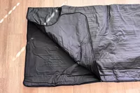 The HEALiX-Z Sauna Blanket on a wooden floor