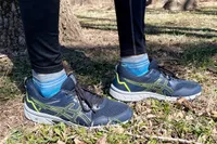 Person wearing Asics Gel-venture 8 Women's Running Shoes in grass