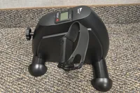 The pedal and strap on the side of the Himaly Mini Exercise Bike