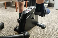 A person pedals the Himaly Mini Exercise Bike