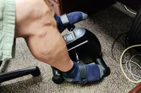A person pedals the Himaly Mini Exercise Bike