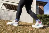 A side view of a person wearing the Hoka Women's Bondi 9