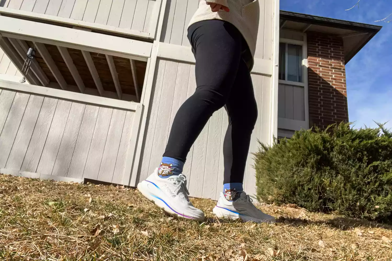 A person walks outside while wearing the Hoka Women's Bondi 9