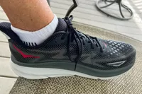 A side view of the Hoka Men's Clifton 9 Running Shoe