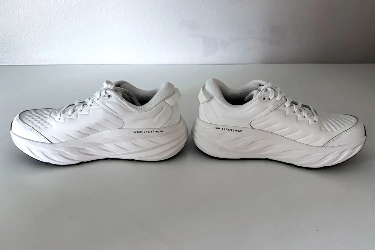 A side view of a pair of Hoka Women's Bondi SR Road Shoes