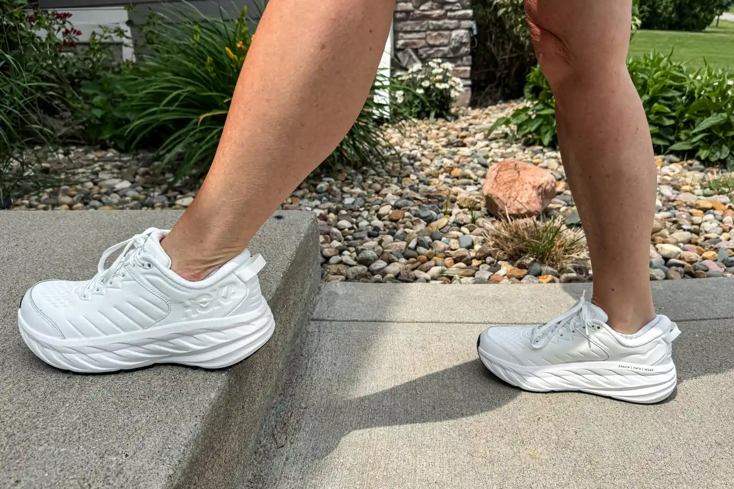 A side view of a person wearing the Hoka Women's Bondi SR Road Shoes