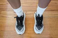 An overhead view of the Hoka Women's Skyflow worn on a wooden floor