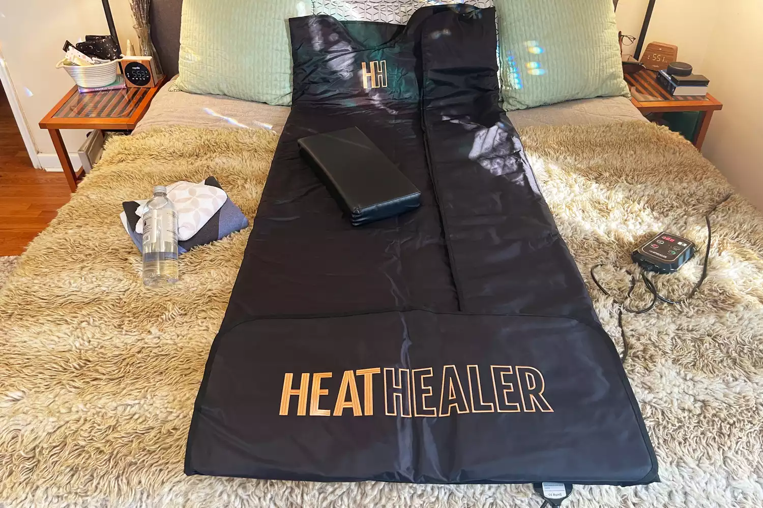 The Heat Healer Infrared Sauna Blanket on a bed
