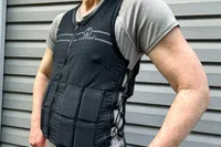 A side view of a person wearing the Hyperwear Women's Hyper Vest Fit Weighted Vest