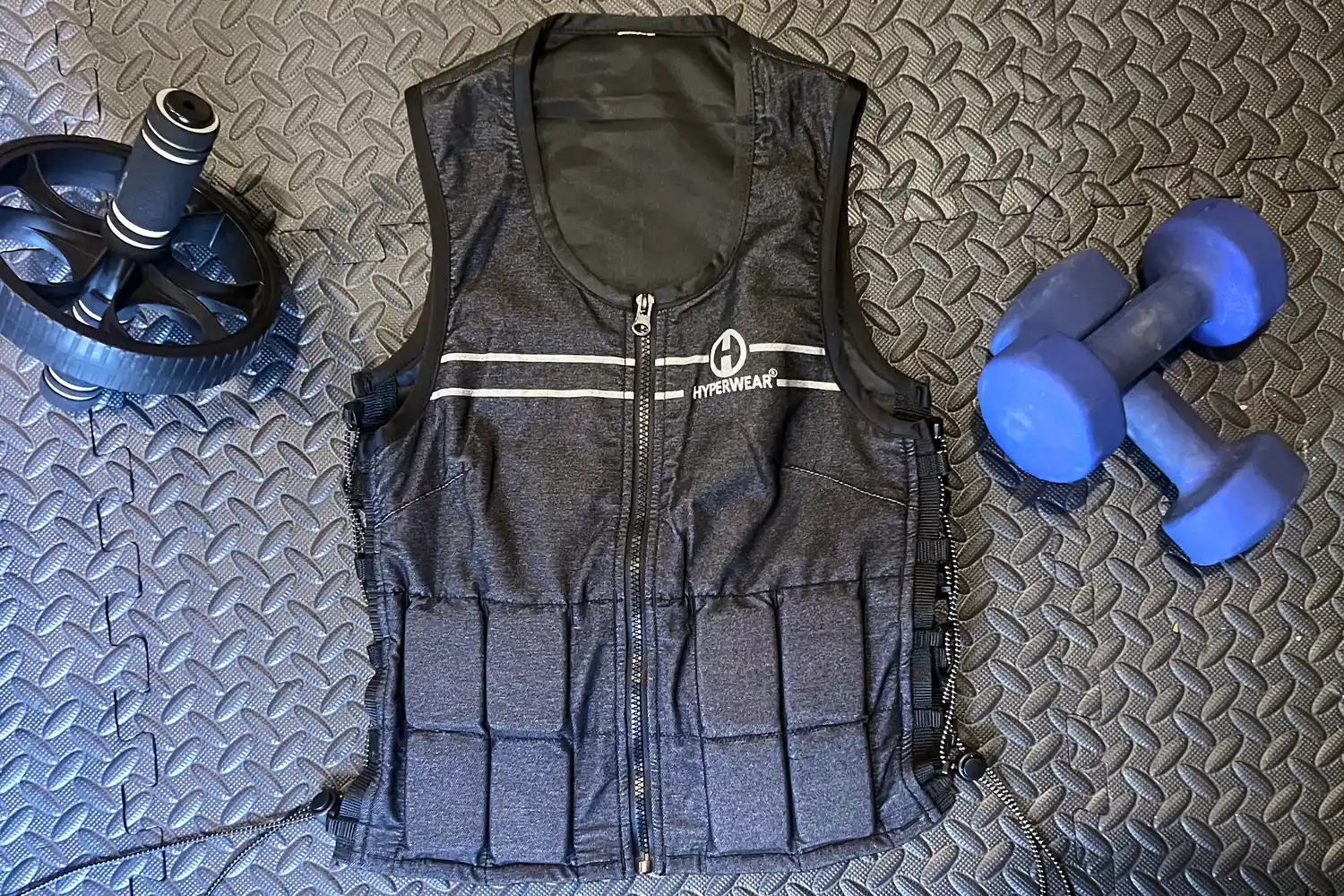 The Hyperwear Women's Hyper Vest Fit Weighted Vest on a gym floor