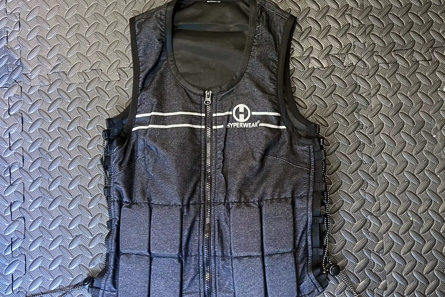 The Hyperwear Women's Hyper Vest Fit Weighted Vest on a gym floor