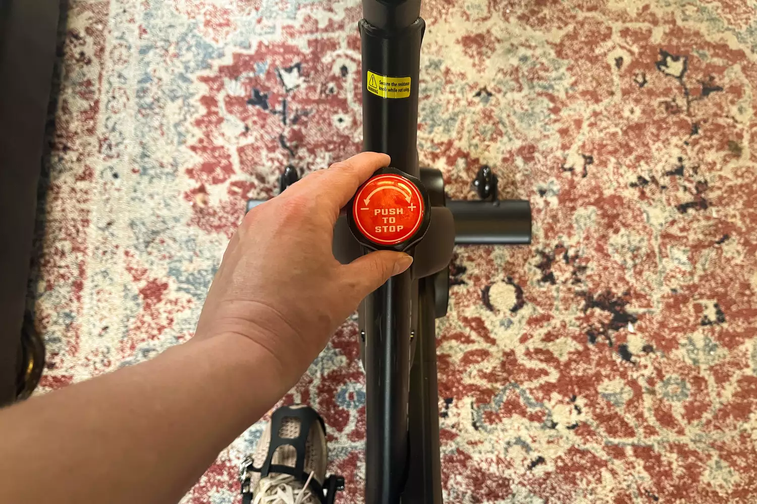 The resistance on the Merach S26 Exercise Bike is adjusted