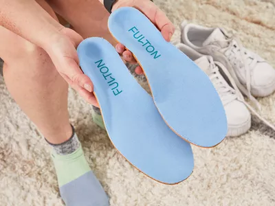 Hands holding Fulton Athletic Insoles