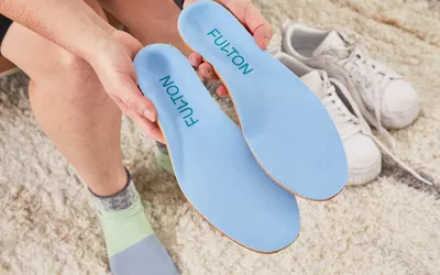 Hands holding Fulton Athletic Insoles