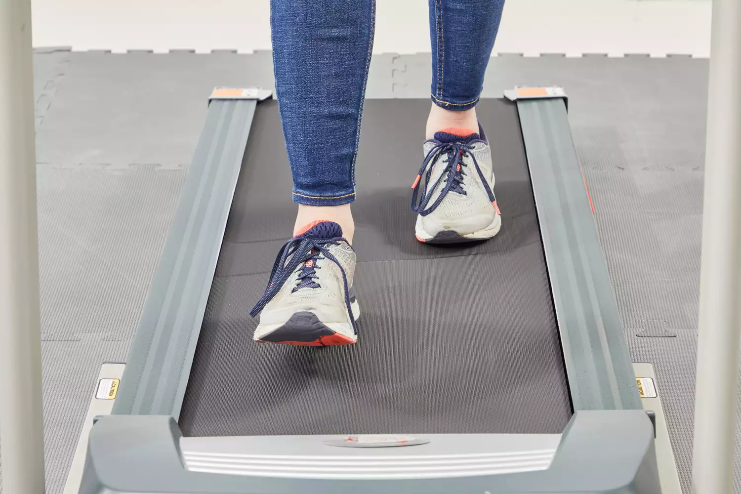 Feet walking on a treadmill