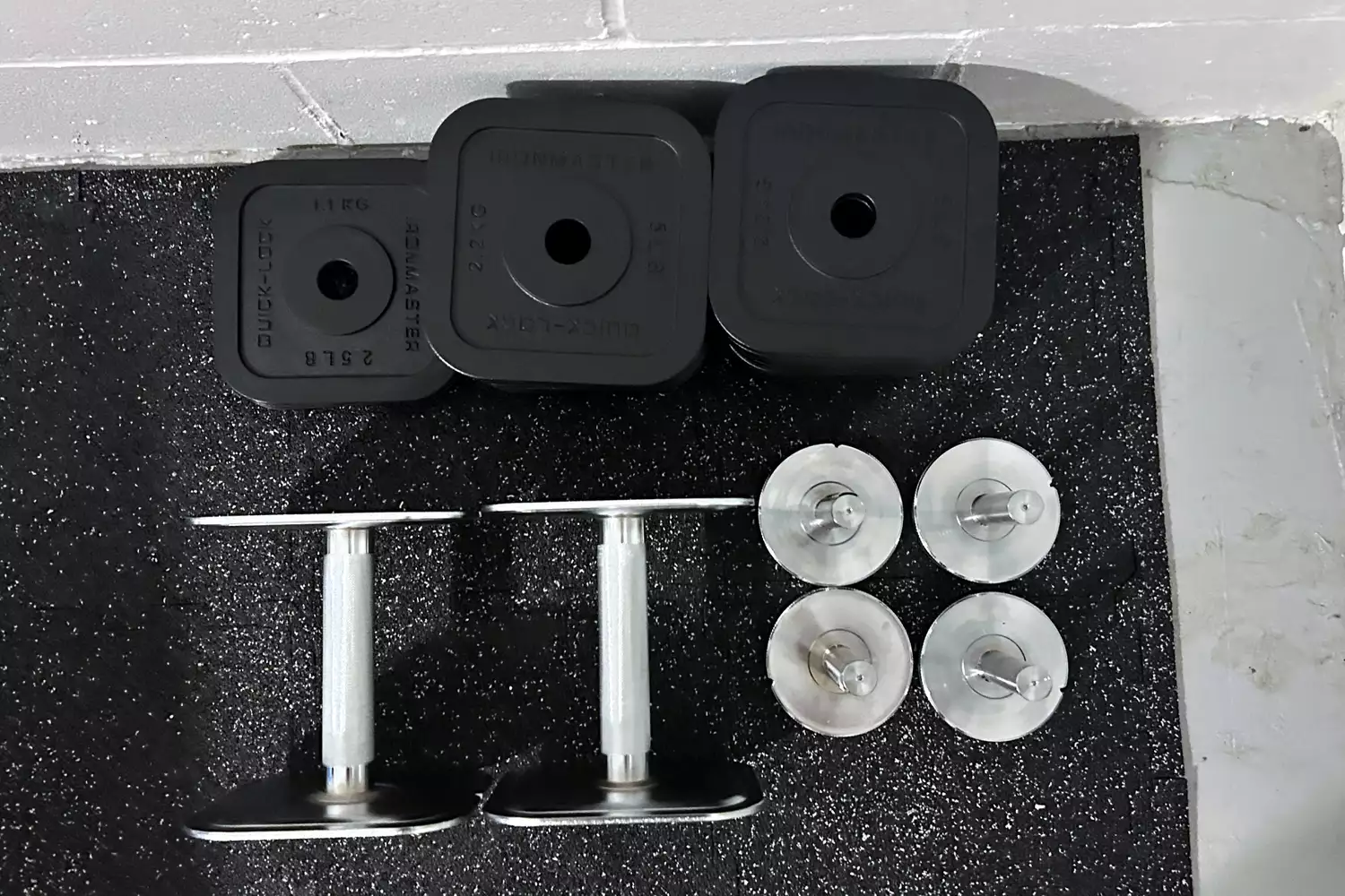 The pieces of the Ironmaster Quick-Lock 75 lb Adjustable Dumbbell System Set