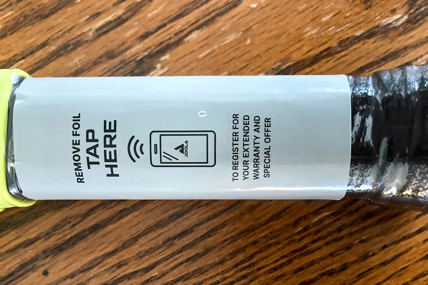 A sticker on the JOOLA Anna Bright Scorpeus 3S 14mm Pickleball Paddle handle