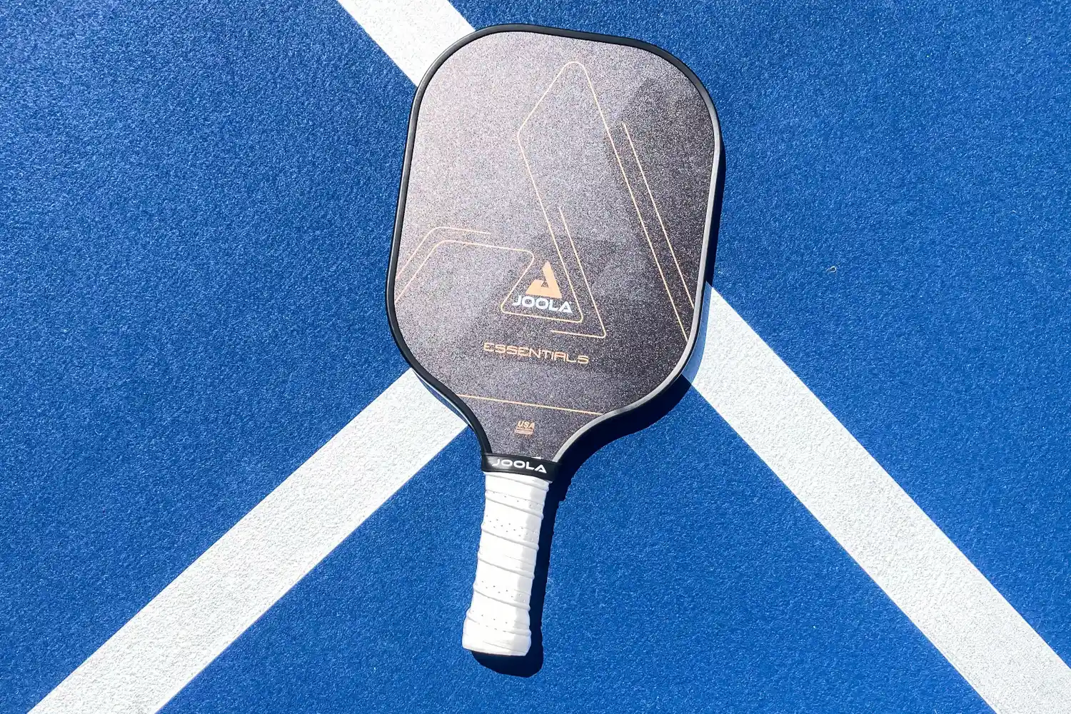 The JOOLA Essentials Pickleball Paddle on a court
