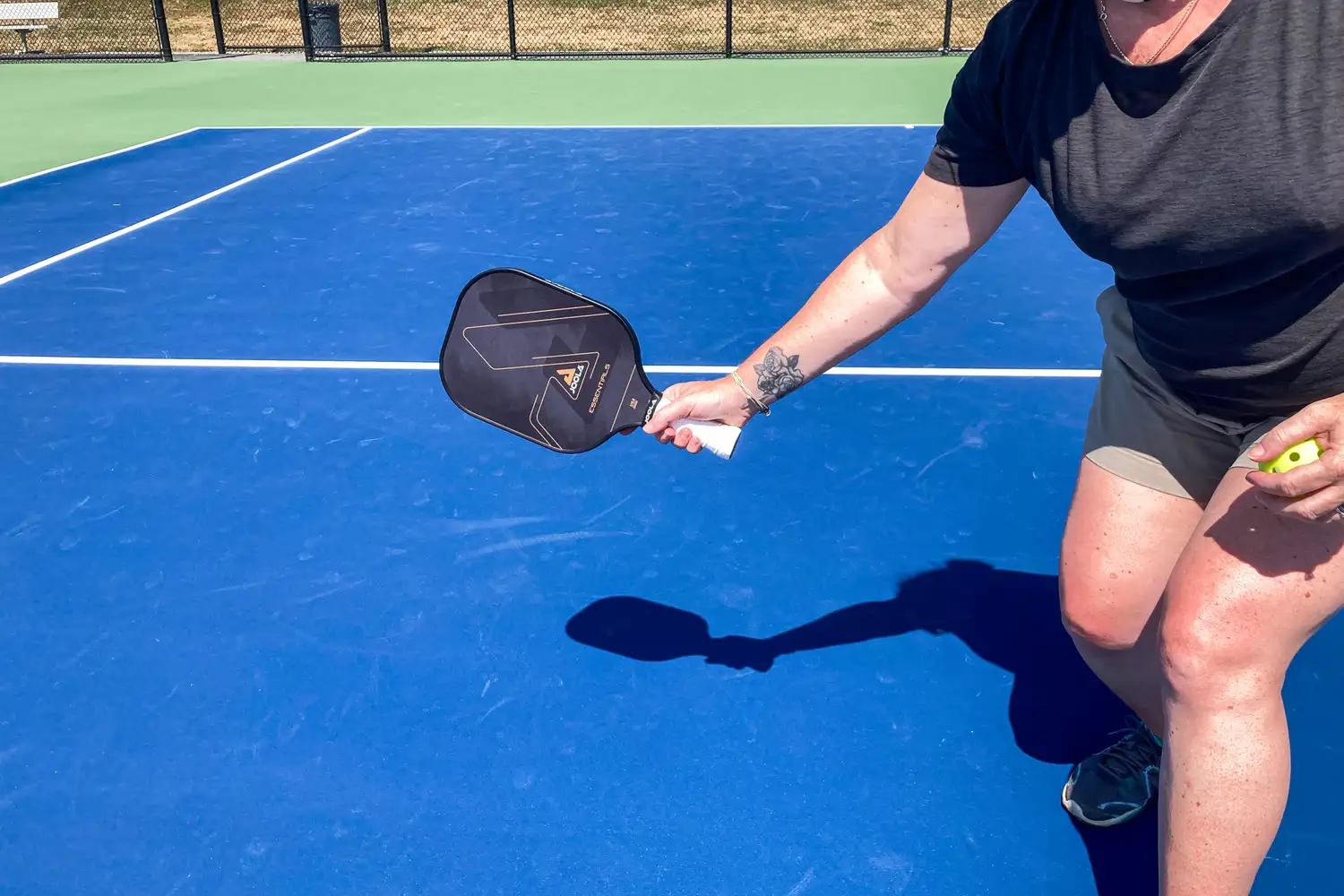 A person holds the JOOLA Essentials Pickleball Paddle