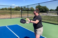 A person plays pickleball with the JOOLA Essentials Pickleball Paddle