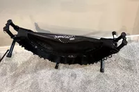 The JumpSport 550f 44-Inch Pro Rebounder Trampoline folded on white carpet