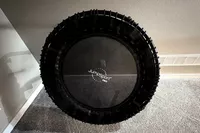 The JumpSport 550f 44-Inch Pro Rebounder Trampoline leans against a wall