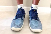 A front view of a person wearing the K-Swiss Men's Pickleball Supreme Shoes