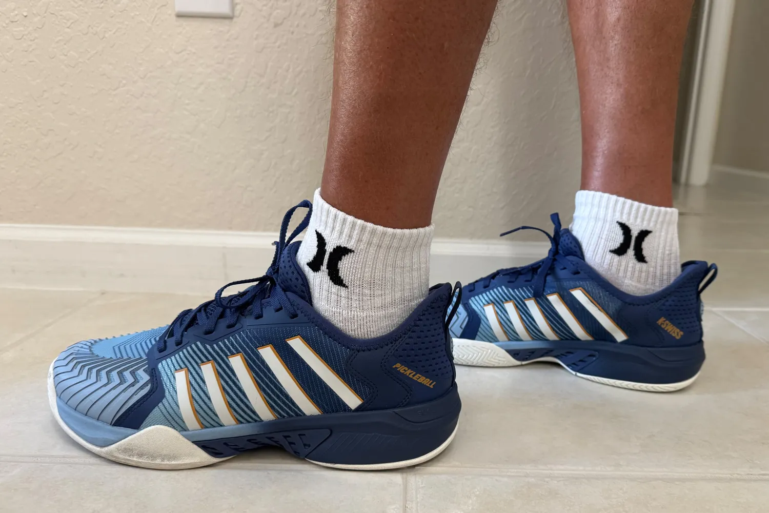 The brand name on the side of the K-Swiss Men's Pickleball Supreme Shoes