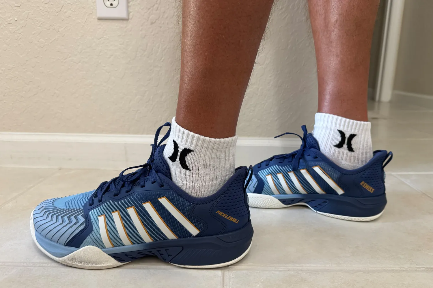 A side view of a person wearing the K-Swiss Men's Pickleball Supreme Shoes