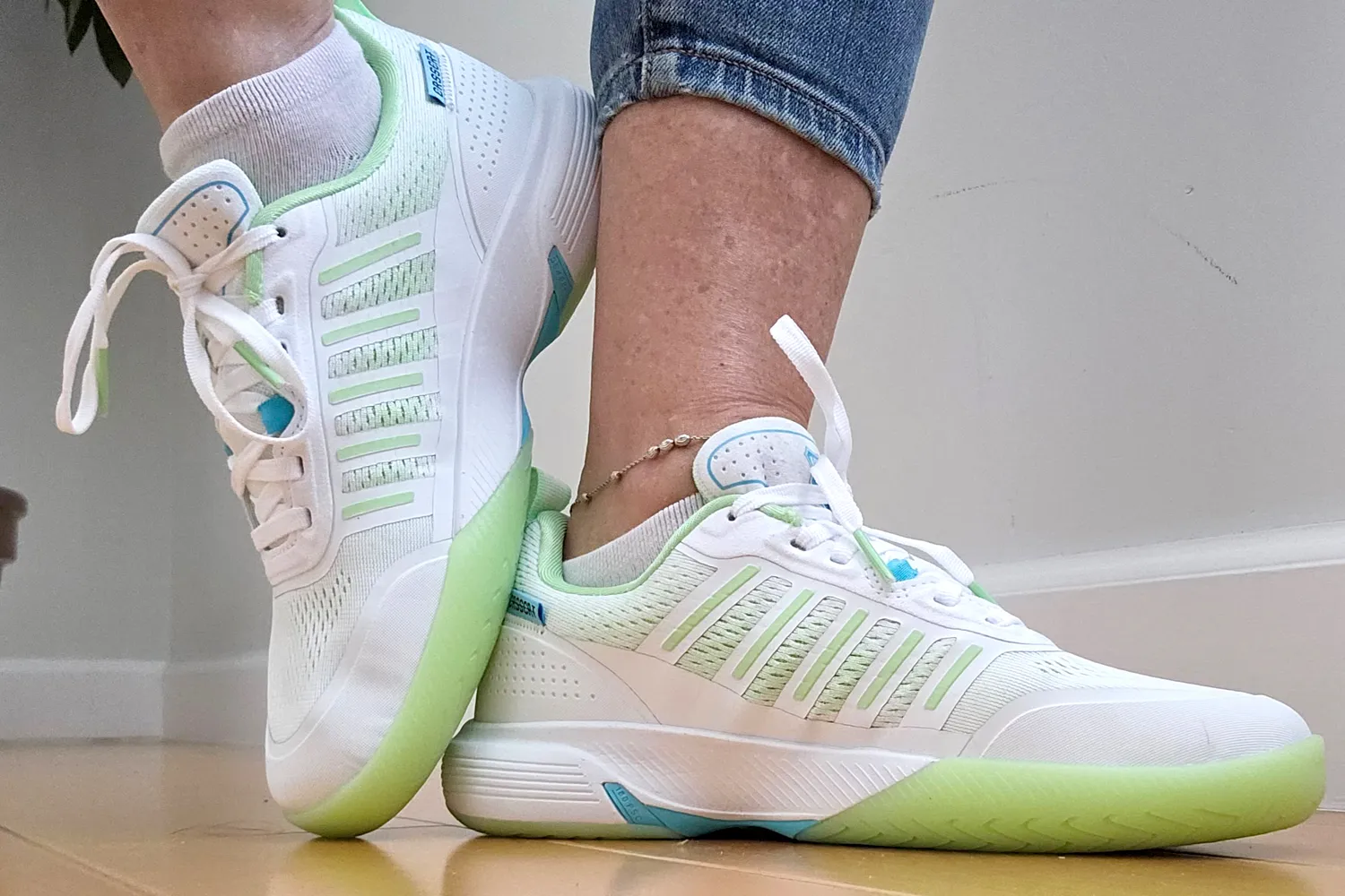 A person poses while wearing the K-Swiss Women's Ultra Court Pickleball Shoes