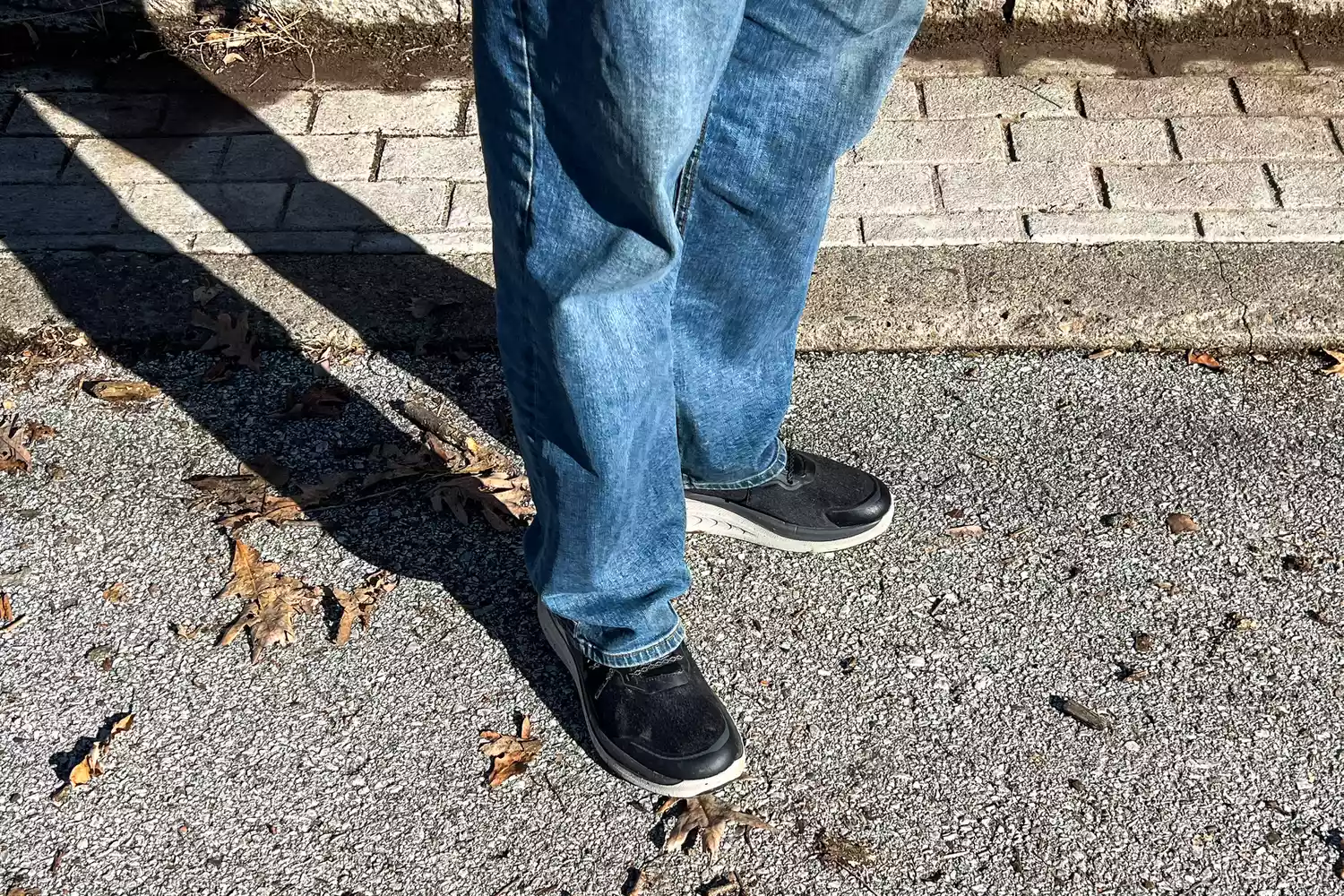 The Keen Men's WK400 II Walking Shoes worn on a road