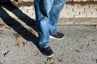 The Keen Men's WK400 II Walking Shoes worn on a road